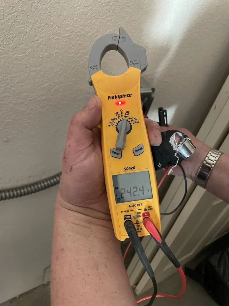 Voltage testing with clamp meter during Whole House Surge Protector in Calcutta